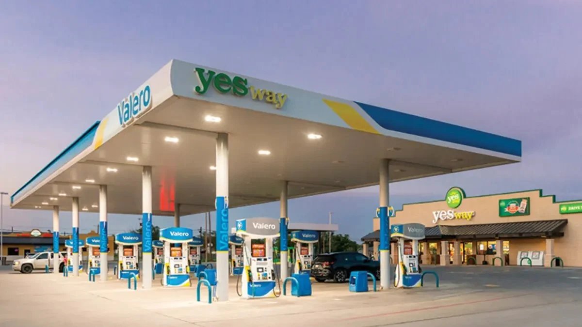 Yesway store forecourt at dusk beneath a lit fuel canopy